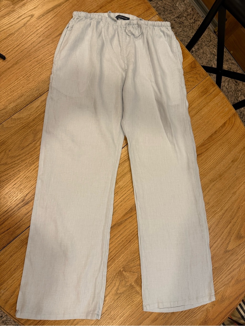 Light shade of blue/gray 100% linen drawstring with elastic waist pants.
